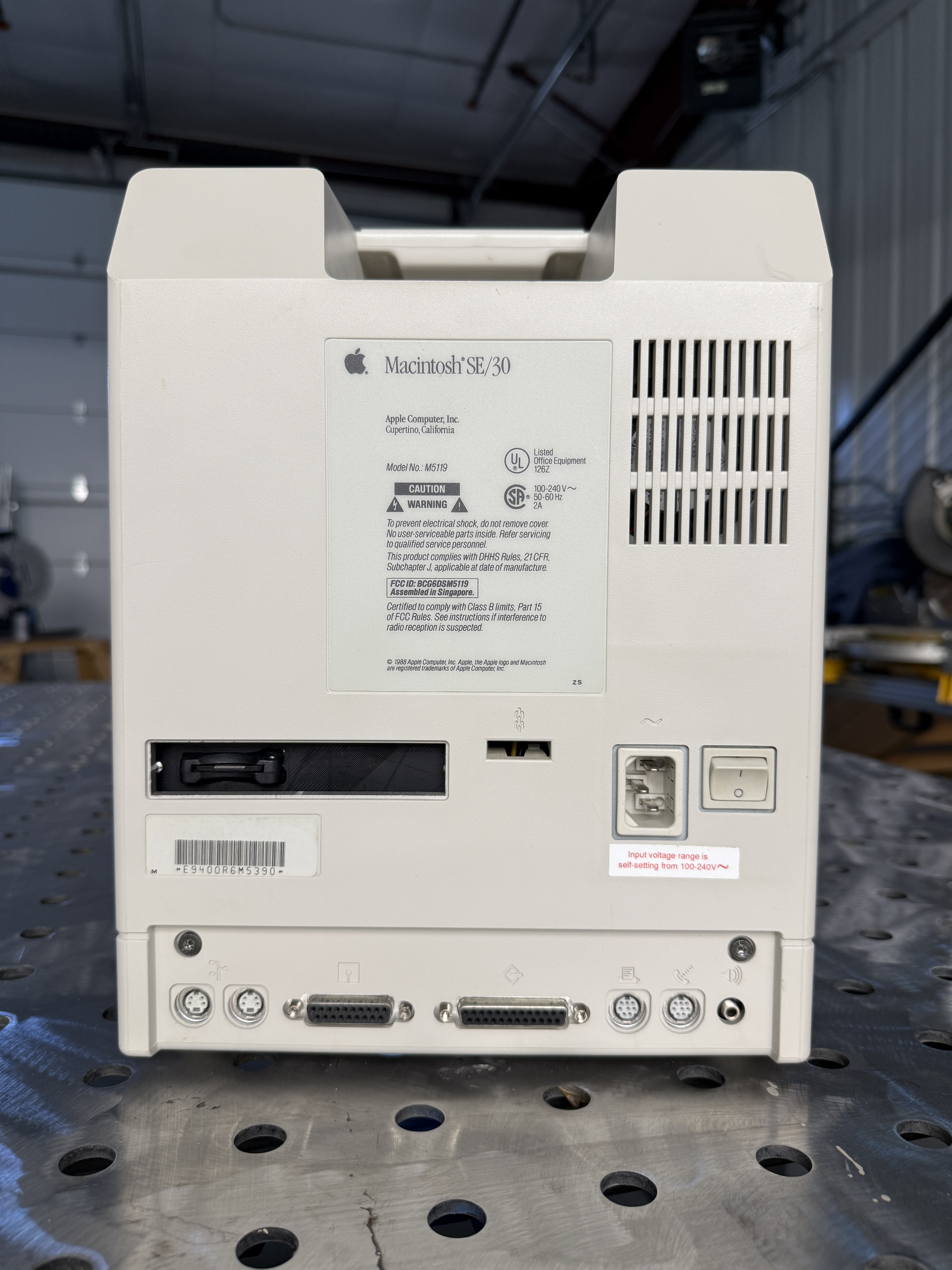 The clean back of the restored SE/30 showing the DB-25 SCSI, DIN-8 serial, ADB, and audio ports