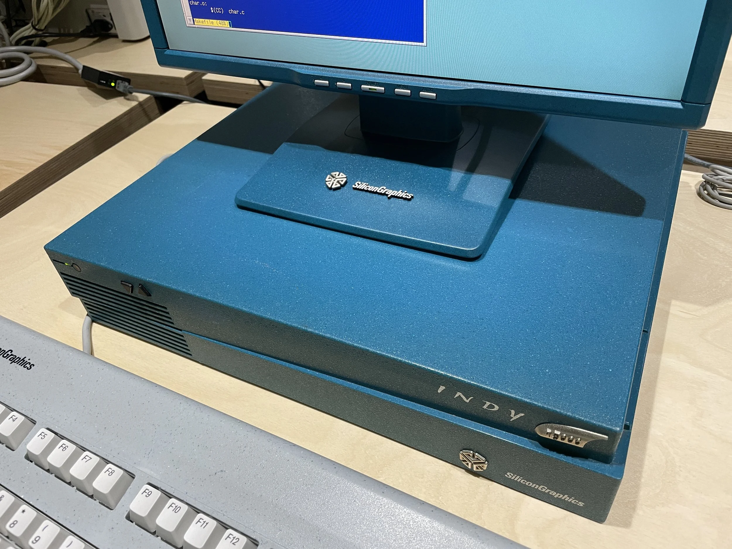 Finished teal Indy-style monitor sitting atop an SGI Indy chassis